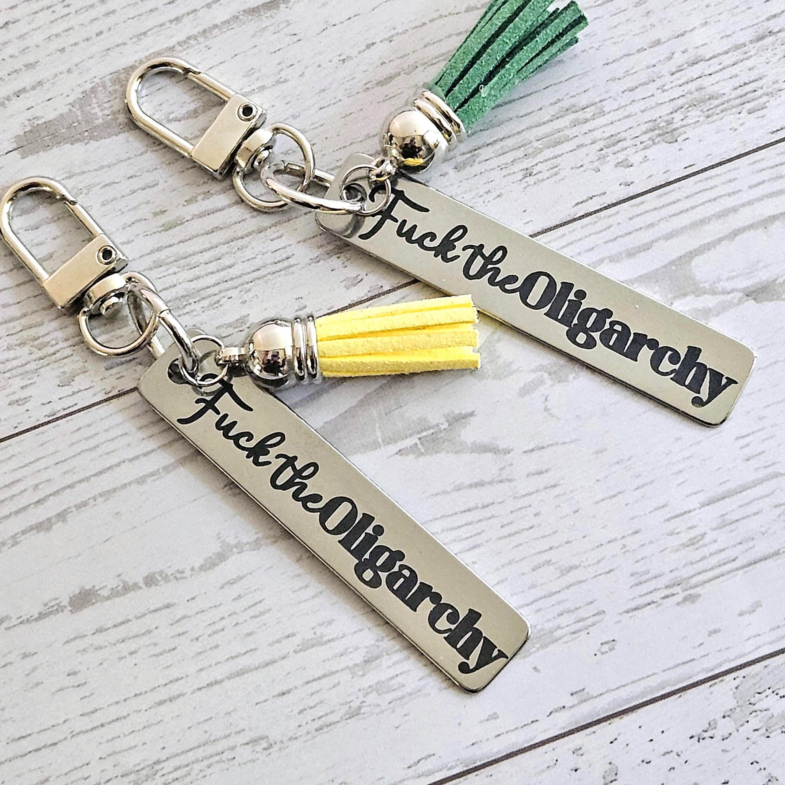 Fuck the Oligarchy Keychain with Tassel – Feminist Stainless Steel Statement Accessory Fuck The Oligarchy Keychain With Tassel – Feminist Stainless Steel Statement Accessory – Keychains – Handmade By Shessocrafty Goods