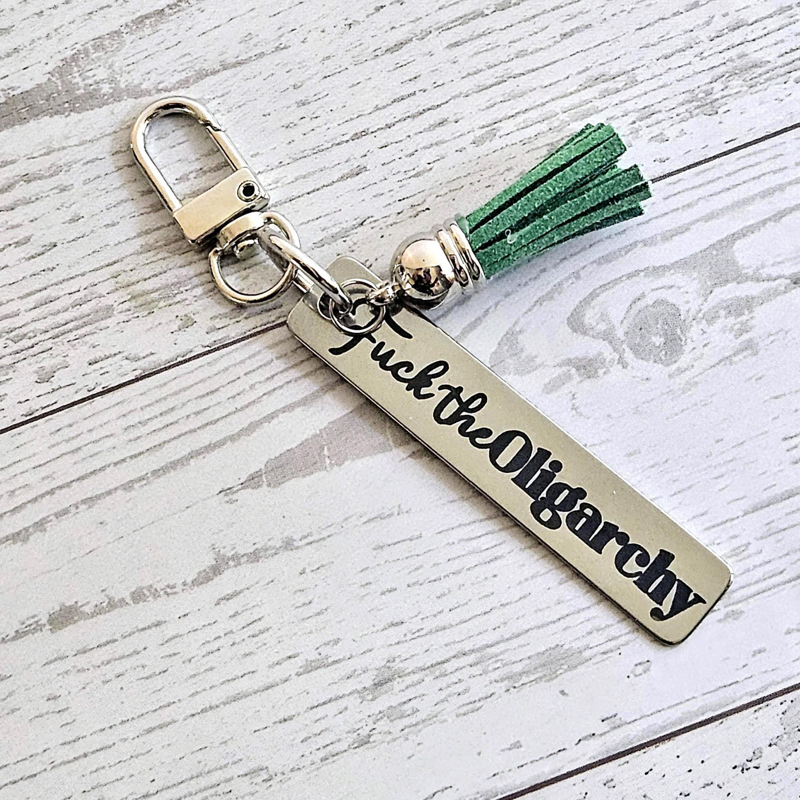 Fuck the Oligarchy Keychain with Tassel – Feminist Stainless Steel Statement Accessory Fuck The Oligarchy Keychain With Tassel – Feminist Stainless Steel Statement Accessory – Keychains – Handmade By Shessocrafty Goods