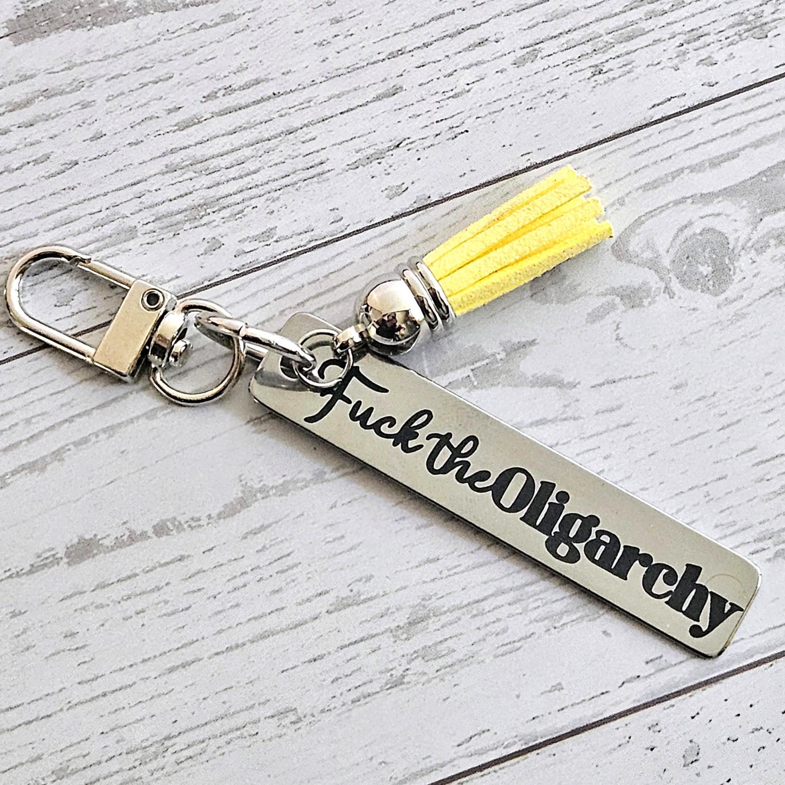Fuck the Oligarchy Keychain with Tassel – Feminist Stainless Steel Statement Accessory Fuck The Oligarchy Keychain With Tassel – Feminist Stainless Steel Statement Accessory – Keychains – Handmade By Shessocrafty Goods