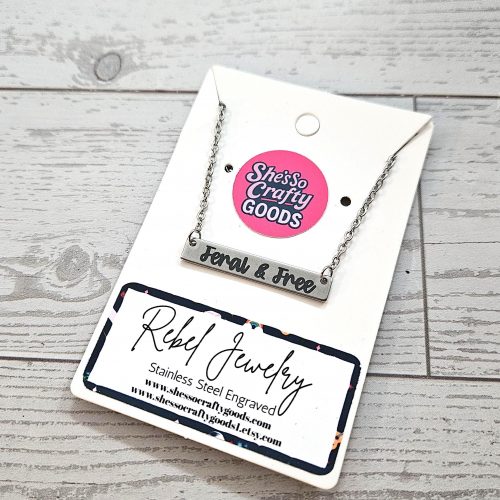 Feral and Free Necklace – Feminist Jewelry Gift – Stainless Steel Bar Pendant with Black Engraving – Jewelry – Handmade by ShesSoCrafty Goods