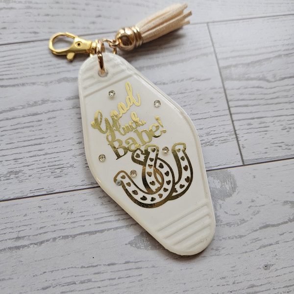 Good Luck Babe Keychain: Chic White Gold Design - Cream Tassel – Keychains – Handmade By Shessocrafty Goods