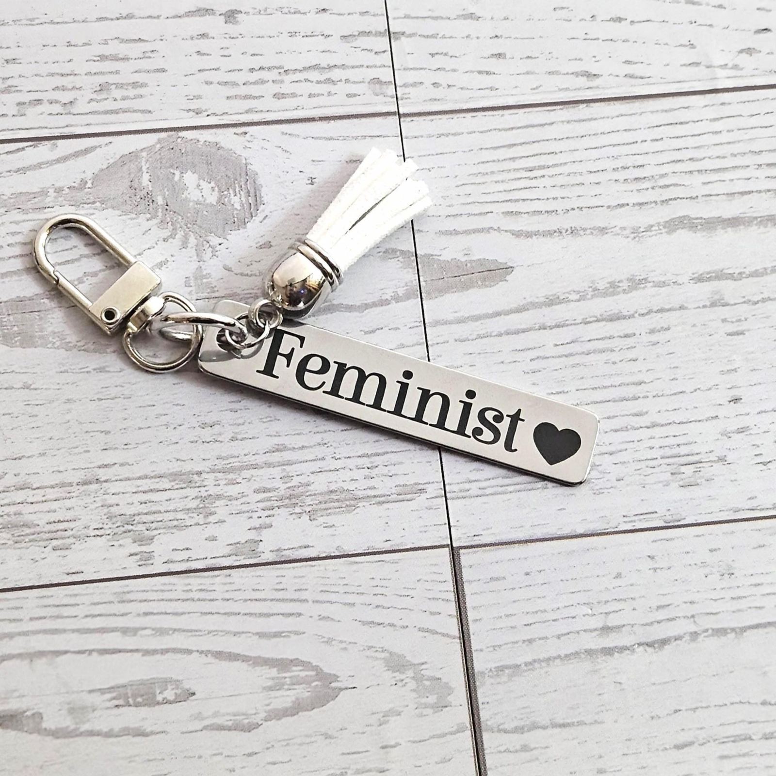 Feminist Keychain β Stainless Steel Statement Accessory with Pink Tassel β Engraved Charm Feminist Keychain β Stainless Steel Statement Accessory with Pink Tassel β Engraved Charm β Keychains β Handmade by ShesSoCrafty Goods