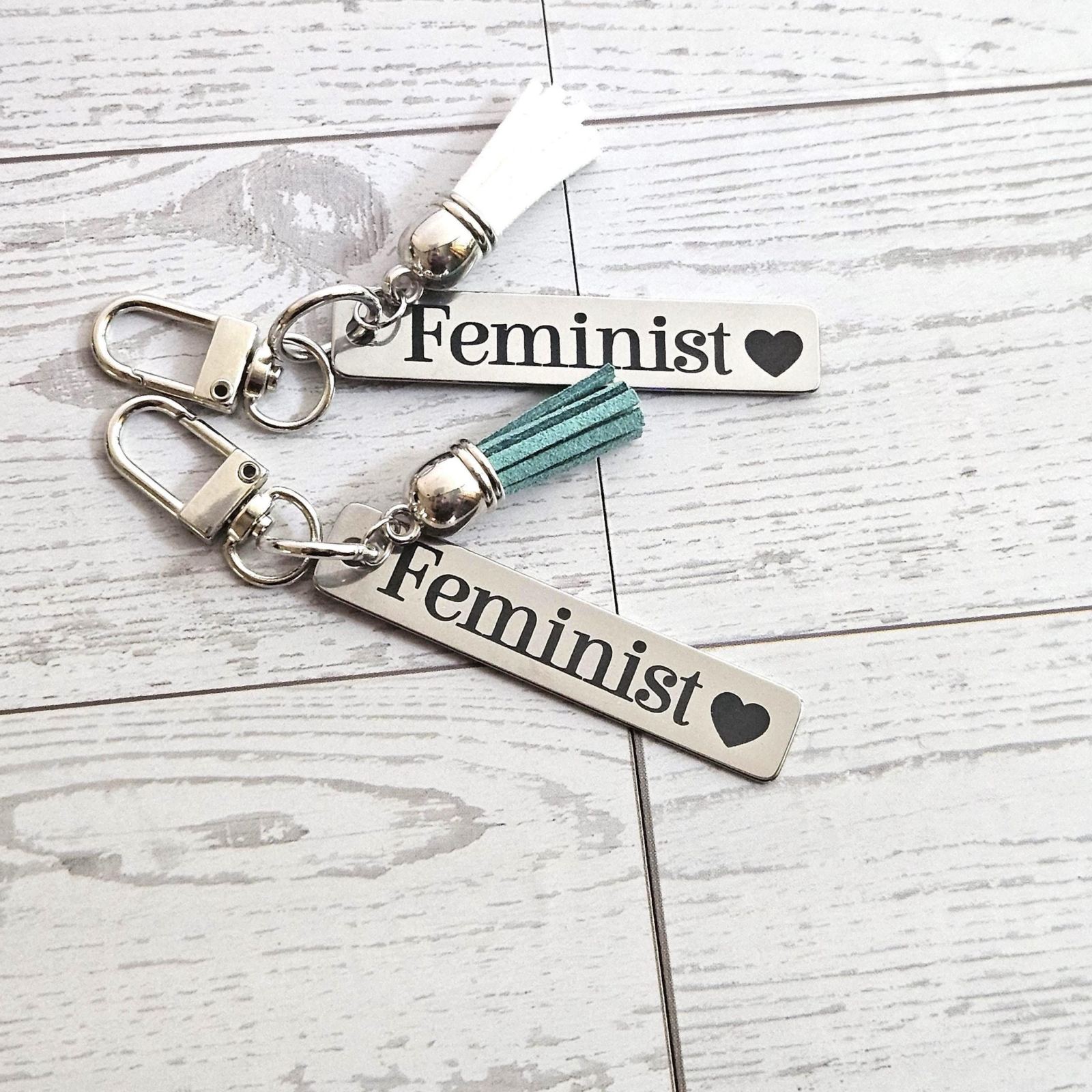 Feminist Keychain β Stainless Steel Statement Accessory with Pink Tassel β Engraved Charm Feminist Keychain β Stainless Steel Statement Accessory with Pink Tassel β Engraved Charm β Keychains β Handmade by ShesSoCrafty Goods