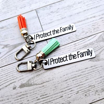 I Protect the Family Keychain • Stainless Steel Bar with Tassel – Keychains – Handmade by ShesSoCrafty Goods