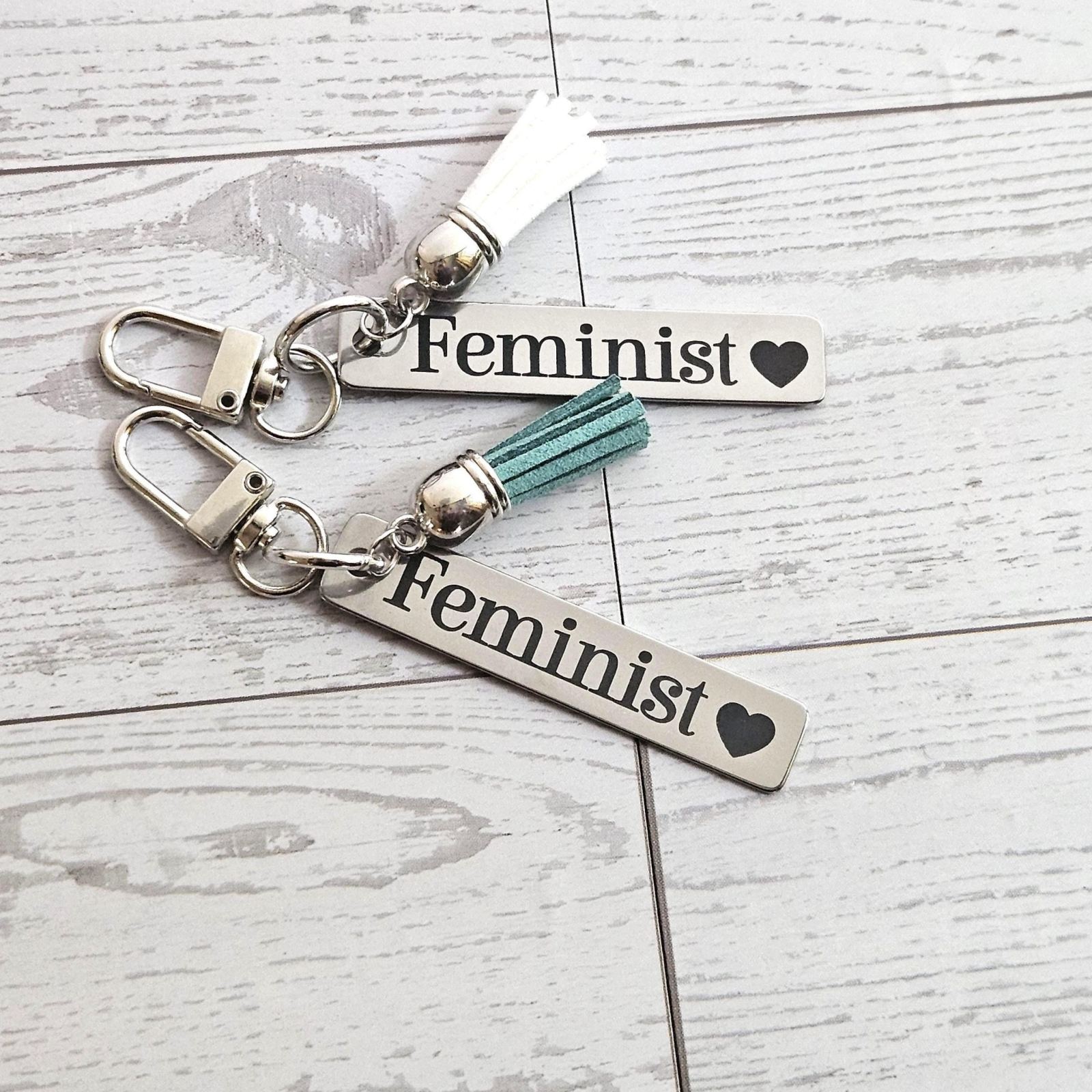 Feminist Keychain β Stainless Steel Statement Accessory with Pink Tassel β Engraved Charm Feminist Keychain β Stainless Steel Statement Accessory with Pink Tassel β Engraved Charm β Keychains β Handmade by ShesSoCrafty Goods