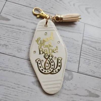 Good Luck Babe Keychain: Chic White Gold Design - Cream Tassel – Keychains – Handmade by ShesSoCrafty Goods