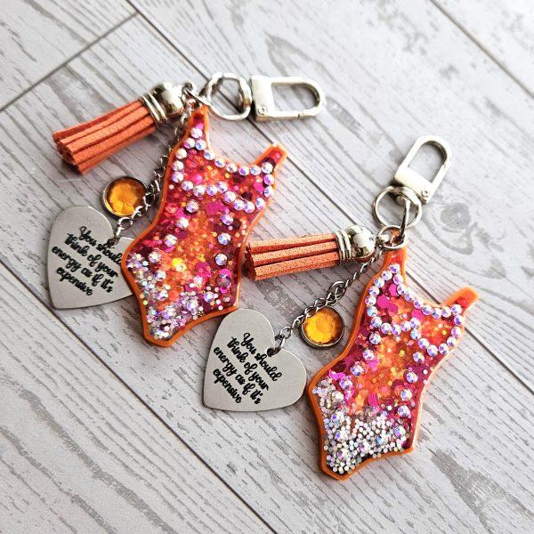 il_fullxfull.7853699924_2rmt Orange Showgirl Era Keychain – Rhinestone Resin Bag Charm with Engraved Quote – Keychains – Handmade by ShesSoCrafty Goods