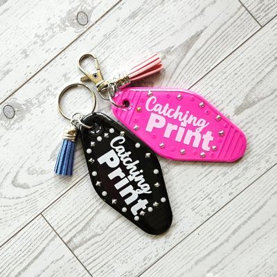 Catching Print Motel Keychain — Funny Cheeky Bag Charm with Studs and Tassel – Keychains – Handmade by ShesSoCrafty Goods