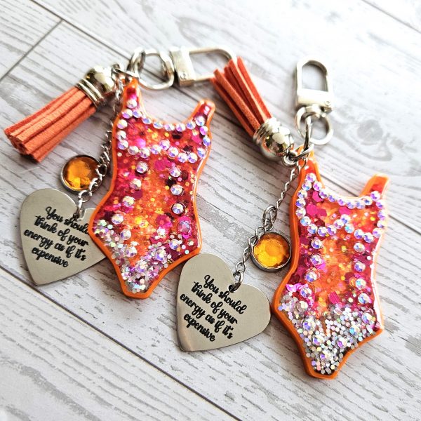 il_fullxfull.7901648819_isdl Orange Showgirl Era Keychain – Rhinestone Resin Bag Charm with Engraved Quote – Keychains – Handmade by ShesSoCrafty Goods