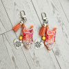 il_fullxfull.7961661883_db44 Orange Showgirl Era Keychain – Rhinestone Resin Bag Charm with Engraved Quote – Keychains – Handmade by ShesSoCrafty Goods